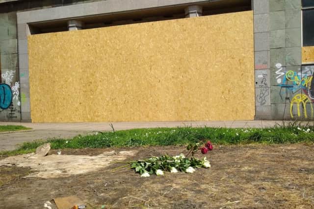 Flowers left where Anne Marie was believed to have been staying in a tent.