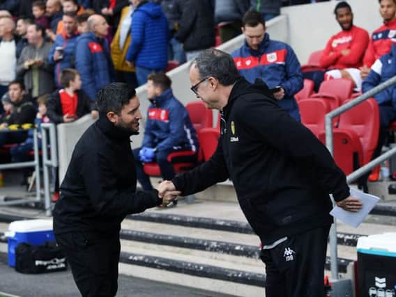 SEE YOU SOON: Bristol City boss Lee Johnson greets Leeds United head coach Marcelo Bielsa at Ashton Gate back in March. The duo will meet again over the first weekend of the new season. Picture by Jonathan Gawthorpe.