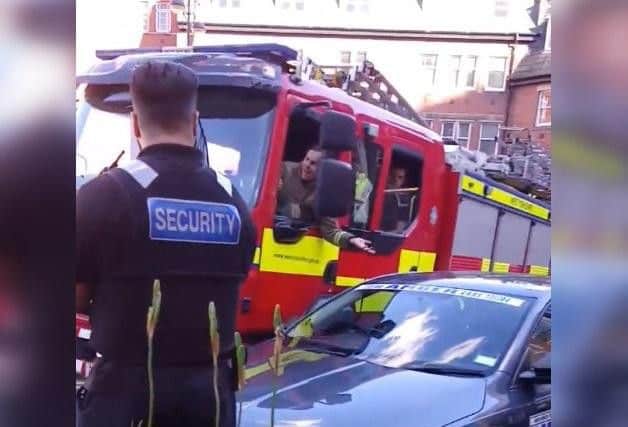 Fire engine struggles to get into Leeds General Infirmary car park due to unattended taxi