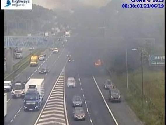 A car is on fire on the M62. Photo: Highways England