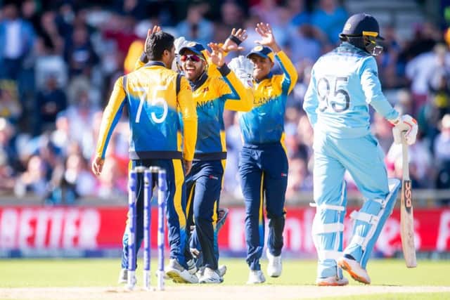 GOING DOWN: Sri Lanka's Dhananjaya de Silva celebrates dismissing England's Adil Rashid. Picture by Allan McKenzie/SWpix.com