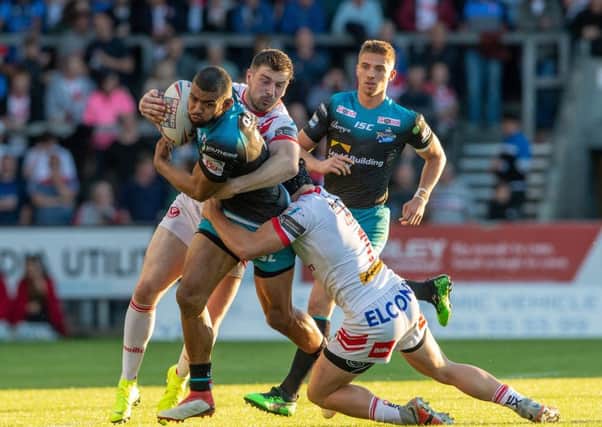 NO GO: Kallum Watkins is held back during Friday night's 36-10 defeat at the Totally Wicked Stadium.
 Picture: Bruce Rollinson