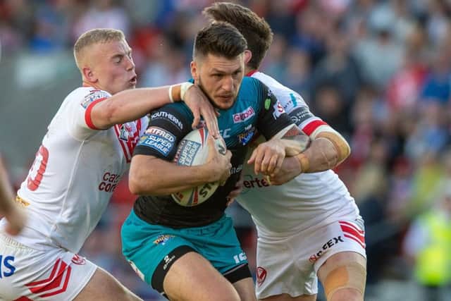 Tom Briscoe is wrapped up by the St Helens defence. PIC: Bruce Rollinson
