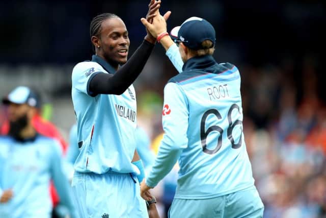 England's Jofra Archer (left) celebrates with Joe Root after taking the wicket of Sri Lanka's Dhananjaya de Silva at Headingley. Picture: Tim Goode/PA