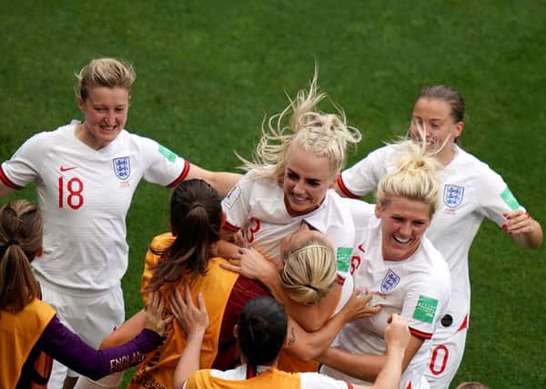 England's Alex Greenwood (3) celebrates scoring her side's third goal against Cameroon in Valenciennes. Picture: John Walton/PA