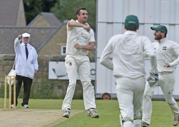 James  Davies jumps for joy after taking the wicket of Toby Jacklin LBW for 0. He took the first three Collingham & Linton wickets in a 141-run win for league leaders Otley. PIC: Steve Riding