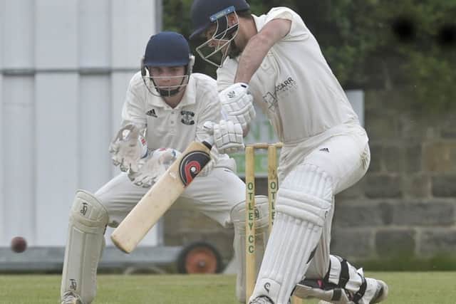 Collingham & Linton's Charlie Swallow, who scored 34, hits a boundary at Otley. PIC: Steve Riding