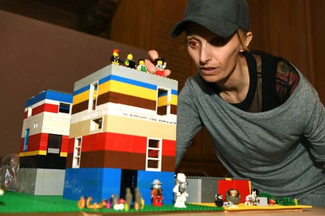 Bigger And Better In Leeds (BABIL), a free Autism Show at Leeds Civic Hall, with Harriet Chapman from Brick 42 and the Lego model representing each of the 8,000 children and adults in Leeds with autism.
