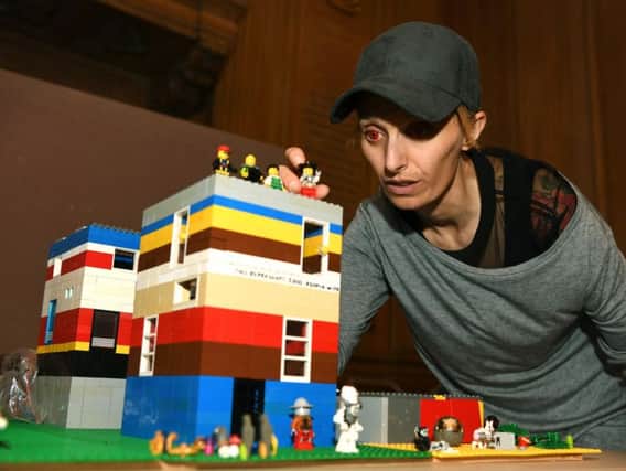 Bigger And Better In Leeds (BABIL), a free Autism Show at Leeds Civic Hall, with Harriet Chapman from Brick 42 and the Lego model representing each of the 8,000 children and adults in Leeds with autism.