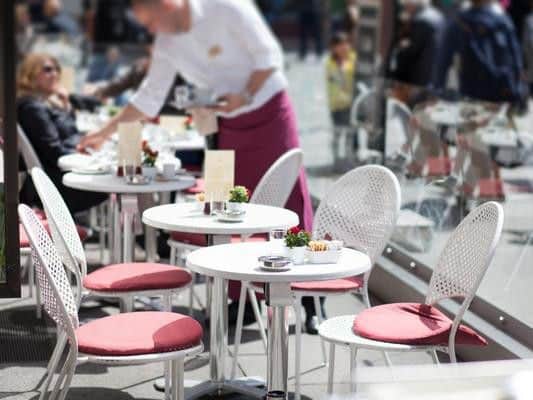 Some cafes and restaurants charge extra for sitting outside