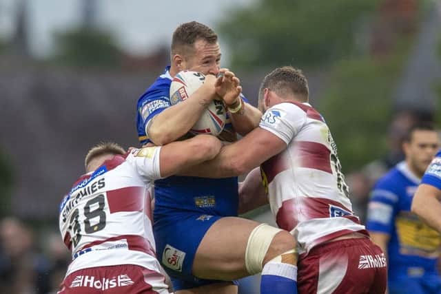 Trent Merrin taking the game to Wigan Warriors. PIC: Bruce Rollinson