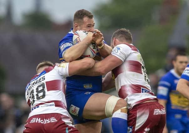 Trent Merrin taking the game to Wigan Warriors. PIC: Bruce Rollinson