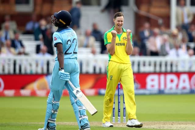 Australia's Jason Behrendorff celebrates taking the wicket of England's Jofra Archer (left), caught by David Warner at Lord's. Picture: Tim Goode/PA