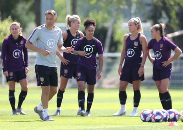 England head coach Phil Neville with the England players.