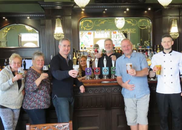 Otley Pub Club members raise a glass to the successful re-opening of Otleys Victorian Hotel by Kirkstall Brewery and Brudenell Social Club.
