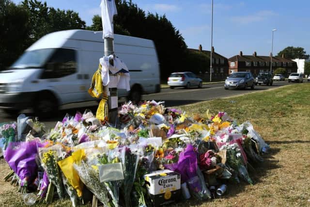 Floral tributes at the car crash site in Broadway, Horsforth on July 4 2018.