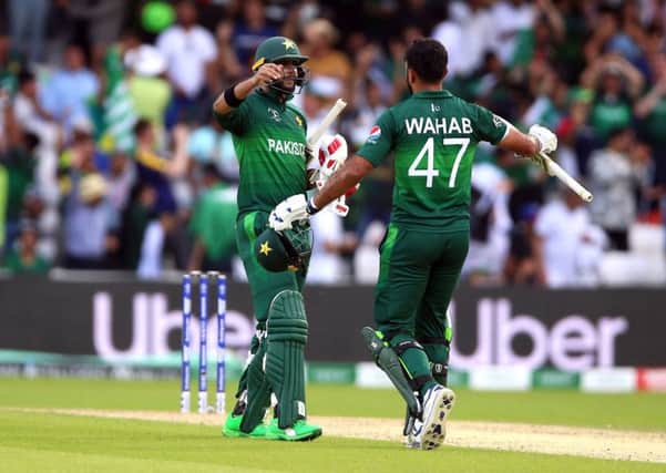 Victory: Pakistan's Imad Wasim, left, and Wahab Riaz celebrate  at Headingley. Picture: Nigel French/PA