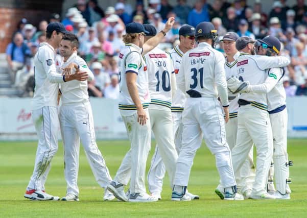 Yorkshire celebrate as Surreys Ryan Patel is caught behind by Jonathan Tattersall for 26, bowled by Keshav Maharaj, at Scarborough.  Picture: Bruce Rollinson