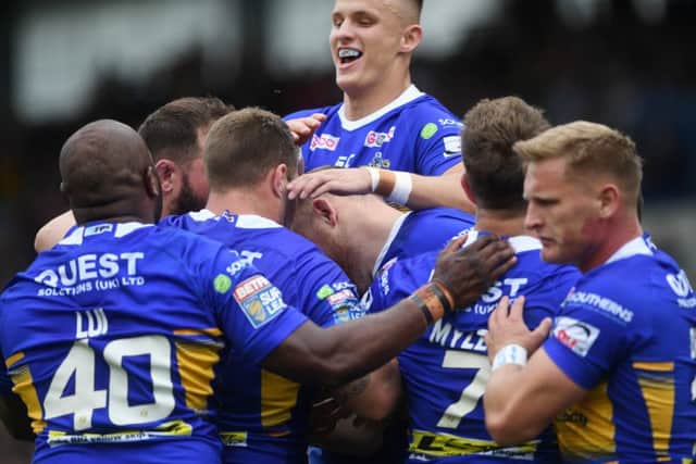 Leeds
Rhinos players congratulate Brad Singleton on his try against Catalans Dragons.