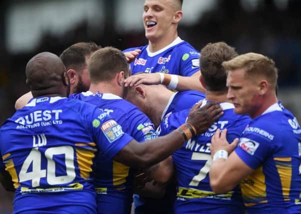Leeds 
Rhinos players congratulate Brad Singleton on his try against Catalans Dragons.
