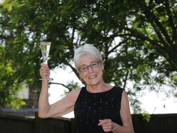 Elizabeth Wilson celebrating her 25k Health Lottery win