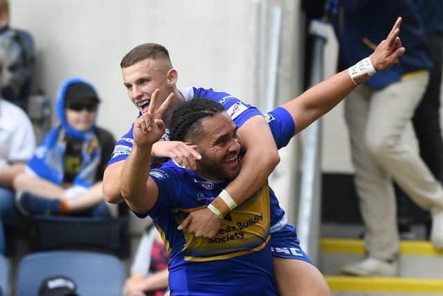 Konrad Hurrell celebrates with Ash Handley after scoring against Catalans Dragons.