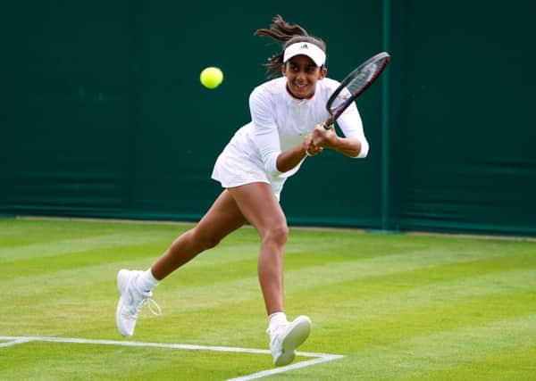 Rising star: Leeds-born Naiktha Bains playing in the womens doubles at Wimbledon yesterday. (Picture: Adam Davy/PA)