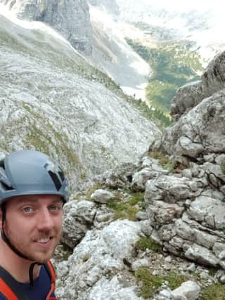 Experienced climber, Luke Dowling, highlights the importance of wearing protective gear after falling almost 30 feet from a cliff face
