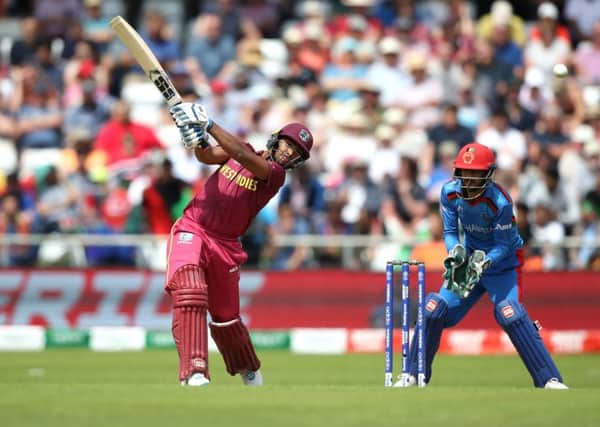West Indies' Nicholas Pooran hits the ball for a boundry during the ICC Cricket World Cup group stage match at Headingley, Leeds.