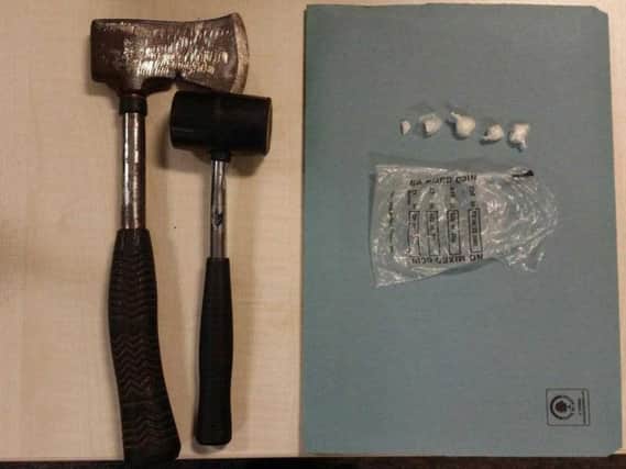 An axe and mallet recovered in Leeds city centre. Photo provided by West Yorkshire Police