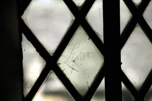 The name Lister carved into an upstairs window at Shibden Hall. Picture by Jonathan Gawthorpe.