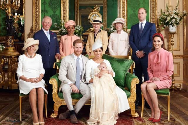 This official christening photograph released by the Duke and Duchess of Sussex shows the Duke and Duchess with their son, Archie and (left to right) the Duchess of Cornwall, The Prince of Wales, Ms Doria Ragland, Lady Jane Fellowes, Lady Sarah McCorquodale, The Duke of Cambridge and The Duchess of Cambridge in the Green Drawing Room at Windsor Castle. Picture by Chris Allerton/SussexRoyal.