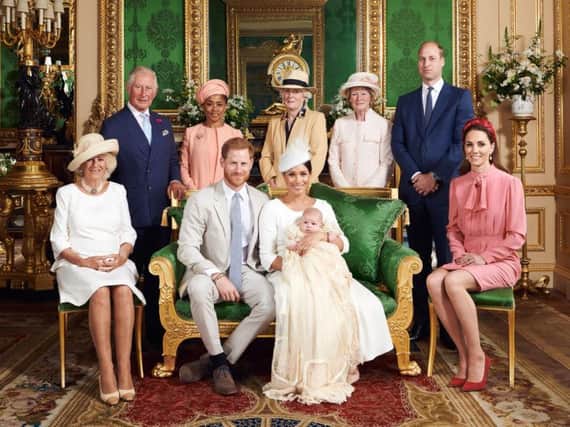 This official christening photograph released by the Duke and Duchess of Sussex shows the Duke and Duchess with their son, Archie and (left to right) the Duchess of Cornwall, The Prince of Wales, Ms Doria Ragland, Lady Jane Fellowes, Lady Sarah McCorquodale, The Duke of Cambridge and The Duchess of Cambridge in the Green Drawing Room at Windsor Castle. Picture by Chris Allerton/SussexRoyal.