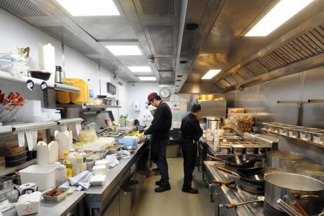 Staff from Noodle Inn working at the Deliveroo Editions kitchen in Leeds.