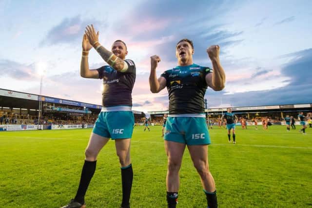 Leeds Rhinos' Brad Singleton, left, celebrates the win at Castleford Tigers with James Donaldson. (PHOTO: Allan McKenzie/SWpix.com)