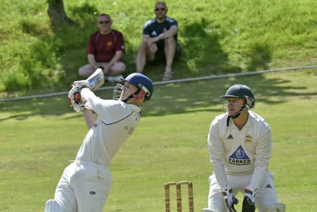 Ewan Brannan, of St Chads, reaches his century with a six, one of the 12 sixes and 25 fours in his innings of 223 not out off 157 balls in th win over league leaders, Green Lane, who suffered their first defeat of the season. PIC: Steve Riding
