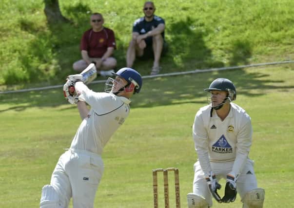 Ewan Brannan, of St Chads, reaches his century with a six, one of the 12 sixes and 25 fours in his innings of 223 not out off 157 balls in th win over league leaders, Green Lane, who suffered their first defeat of the season. PIC: Steve Riding