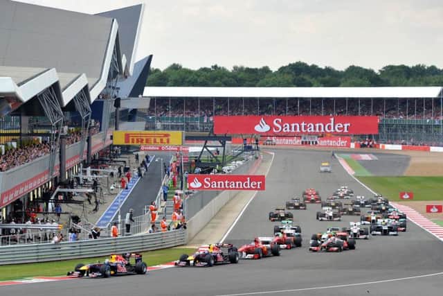 STICKING WITH TRADITION: Cars round the first corner during the Formula One Santander British Grand Prix at Silverstone in July 2011. Picture: Martin Rickett/PA Wire.