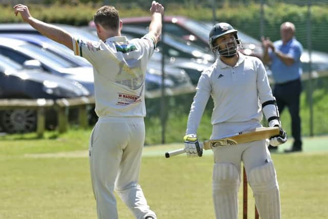 Richard Lamb gets the wicket of Methley opener Adal Islam for three in the win for Pudsey St Lawrence that cut the gap at the top. PIC: Steve Riding