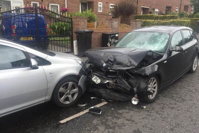 The smashed BMW and Corsa.