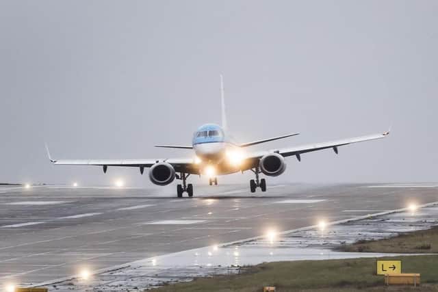Plane landing at Leeds Bradford Airport. (Credit: PA)