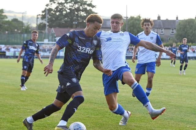 Leeds' Helder Costa looks to take on a trailist for Guiseley. Pictures: Andrew Roe