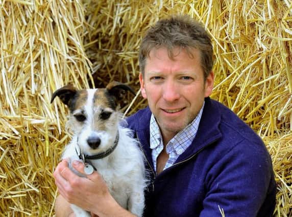 One of the Yorkshire Vets, Julian Norton, with his dog Emmy at Cannon Hall Farm near Barnsley, where Springtime on the Farm filmed for Channel Five. Picture: Gary Longbottom.