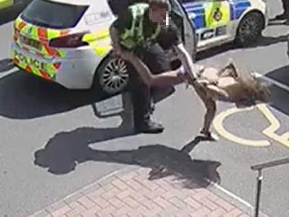 CCTV footage shows he moment a mother-of-two was thrown to the ground by a police officer while being arrested in Leeds