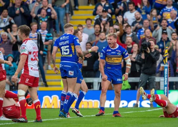 Brad Dwyer celebrates scoring Leeds Rhinos' first try.
 Picture: Bruce Rollinson