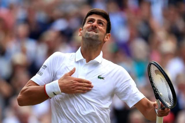 Novak Djokovic celebrates defeating Roger Federer on Centre Court. Picture: Mike Egerton/PA