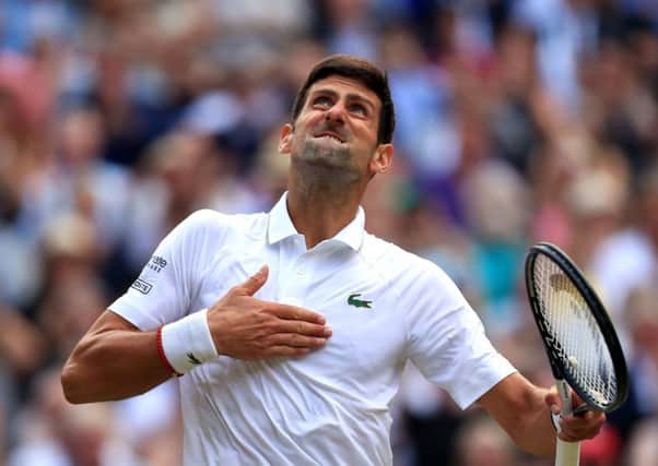 Novak Djokovic celebrates defeating Roger Federer on Centre Court. Picture: Mike Egerton/PA