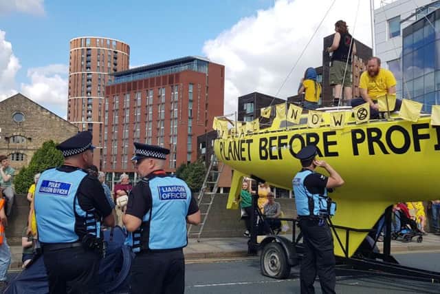 Police talking to Extinction Rebellion protesters