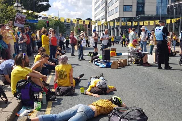Protesters lie in the street