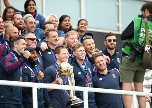 England players pose with the trophy.